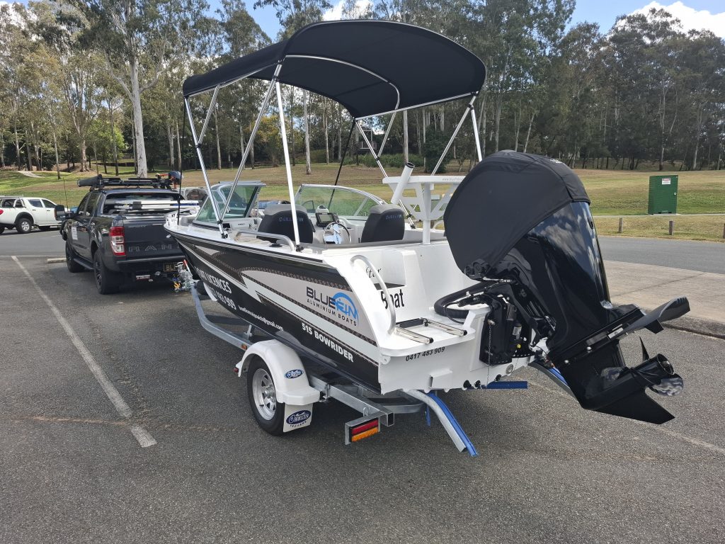 Rear view boat an dtow vehicle